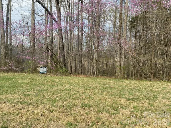 a fire hydrant in the middle of a field