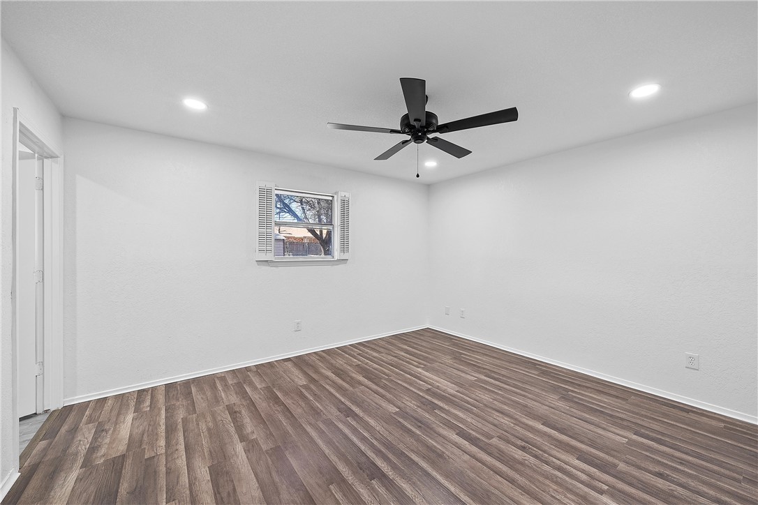 337 Travis Lane Hewitt, TX 76643 - Photo 14 of 22 an empty room with a window and a fan