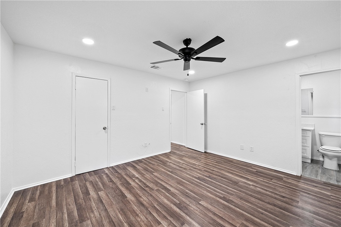 337 Travis Lane Hewitt, TX 76643 - Photo 15 of 22 a view of empty room with wooden floor and fan