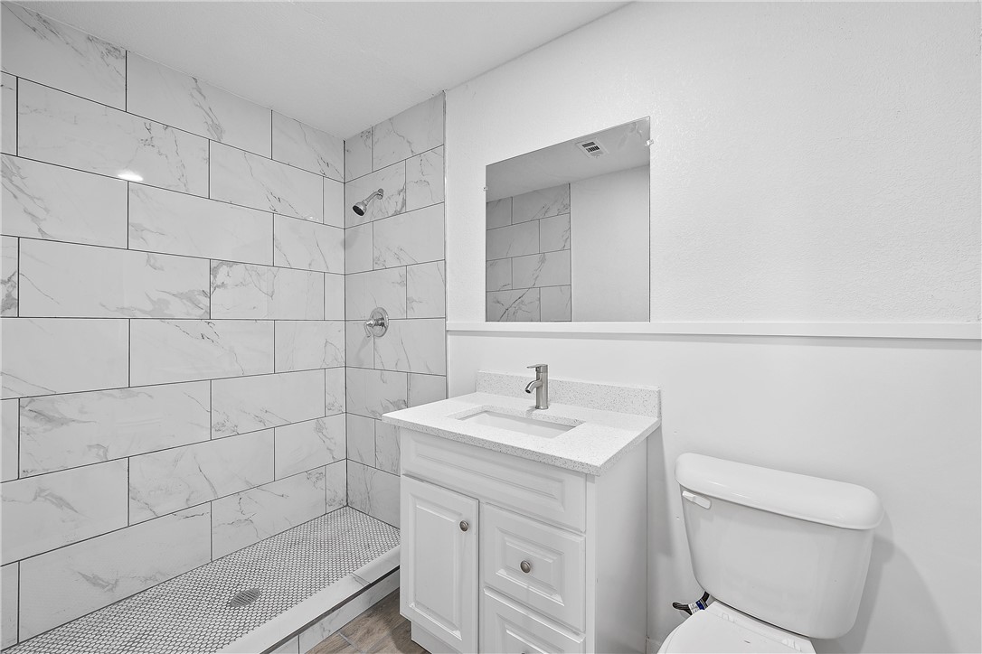 337 Travis Lane Hewitt, TX 76643 - Photo 16 of 22 a bathroom with a sink a toilet and shower