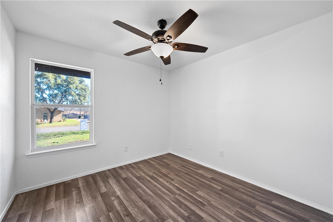 337 Travis Lane Hewitt, TX 76643 - Photo 17 of 22 wooden floor in an empty room with a window