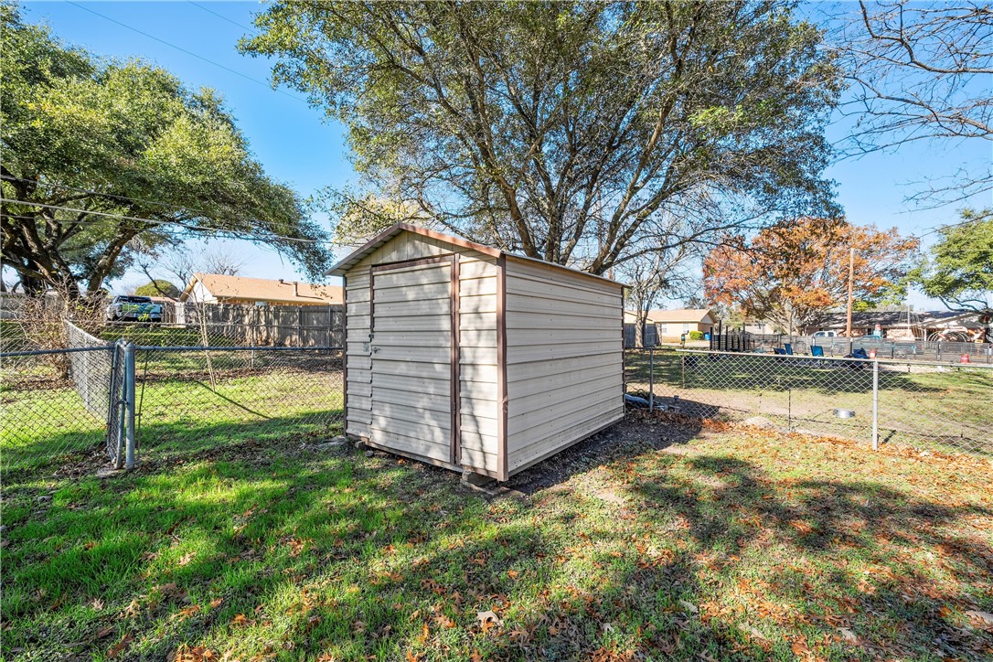 337 Travis Lane Hewitt, TX 76643 - Photo 22 of 22 a view of a house with backyard and trees