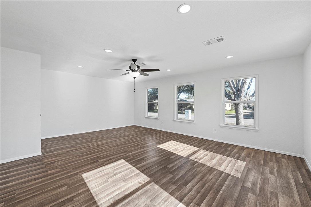337 Travis Lane Hewitt, TX 76643 - Photo 7 of 22 a view of an empty room window and wooden floor