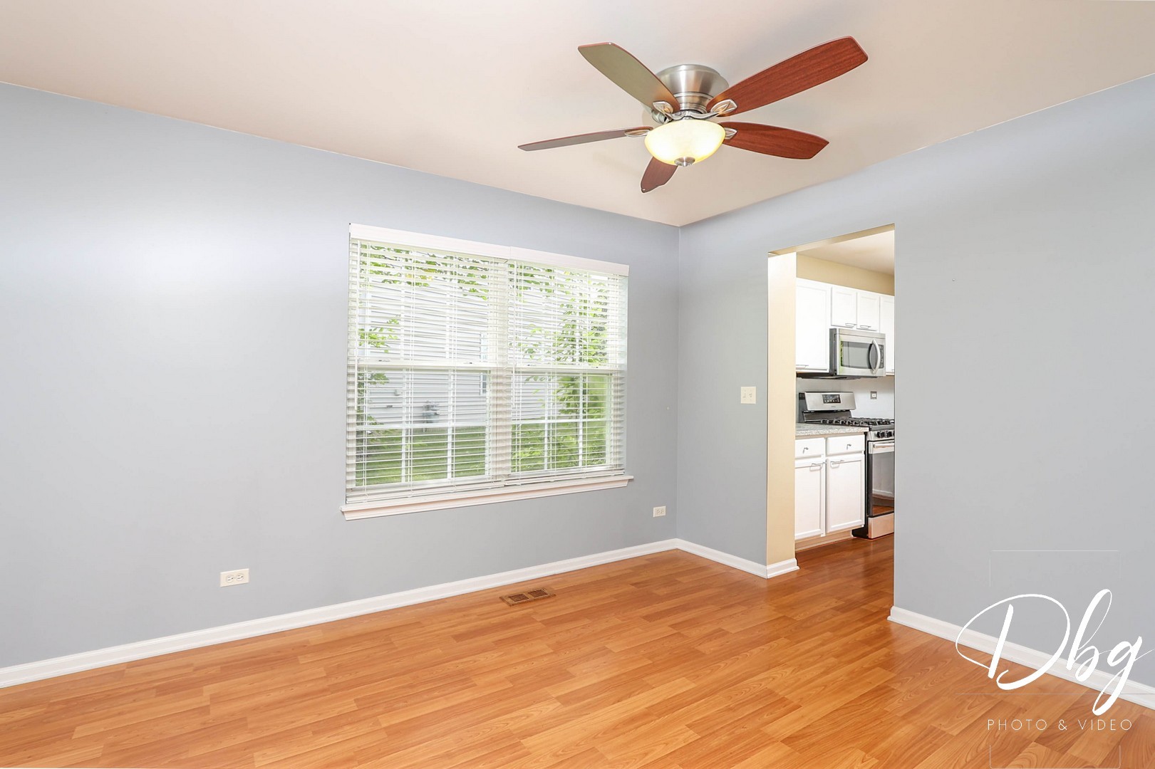 250 Jasmine Circle Lindenhurst, IL 60046 - Photo 4 of 24 a view of an empty room with wooden floor and a window