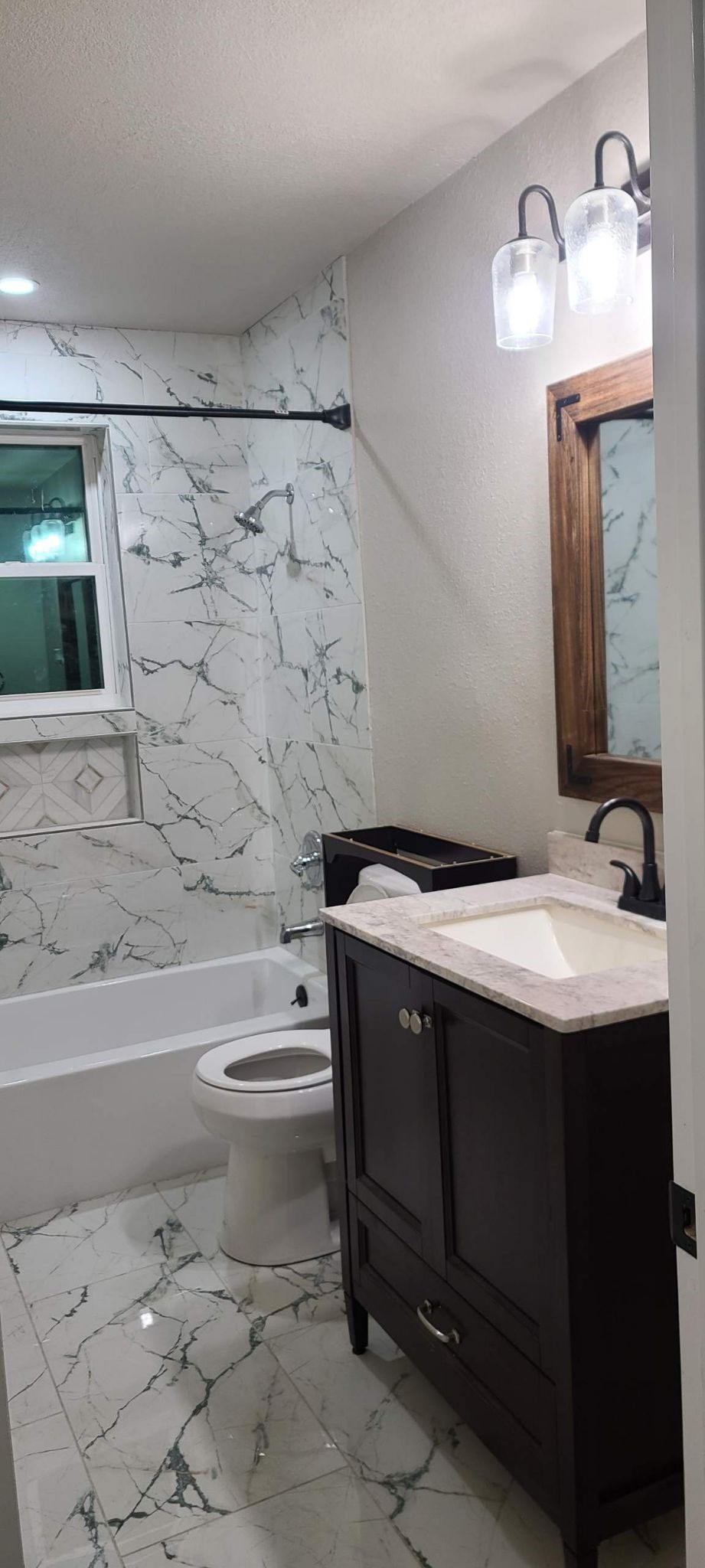 791 Fortune Street, Unit 4 Houston, TX 77088 - Photo 3 of 8 a bathroom with a sink toilet and shower