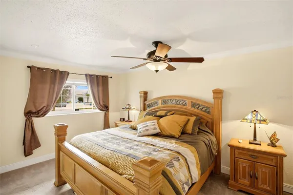 a bedroom with a bed and dresser