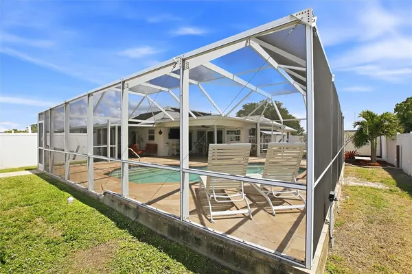 a view of a house with a backyard