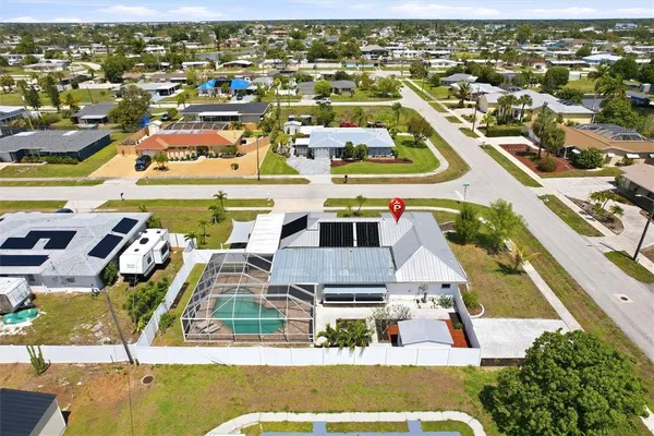 an aerial view of residential houses with outdoor space