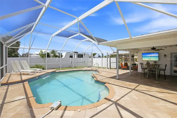 a view of a swimming pool with a patio