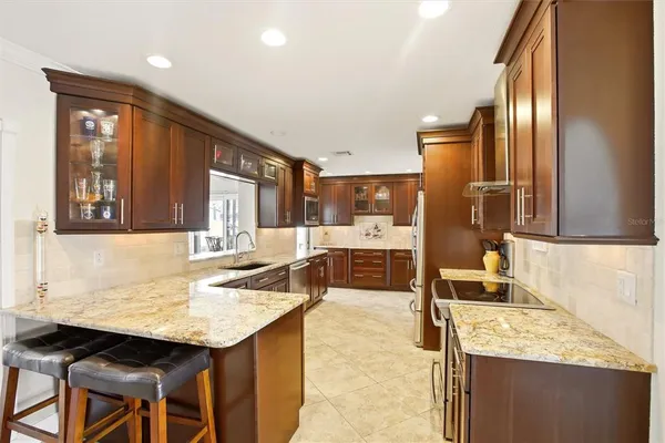 a kitchen with granite countertop a sink and counter space