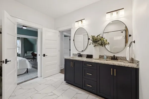 aerial view of a house with a yard and a large pool