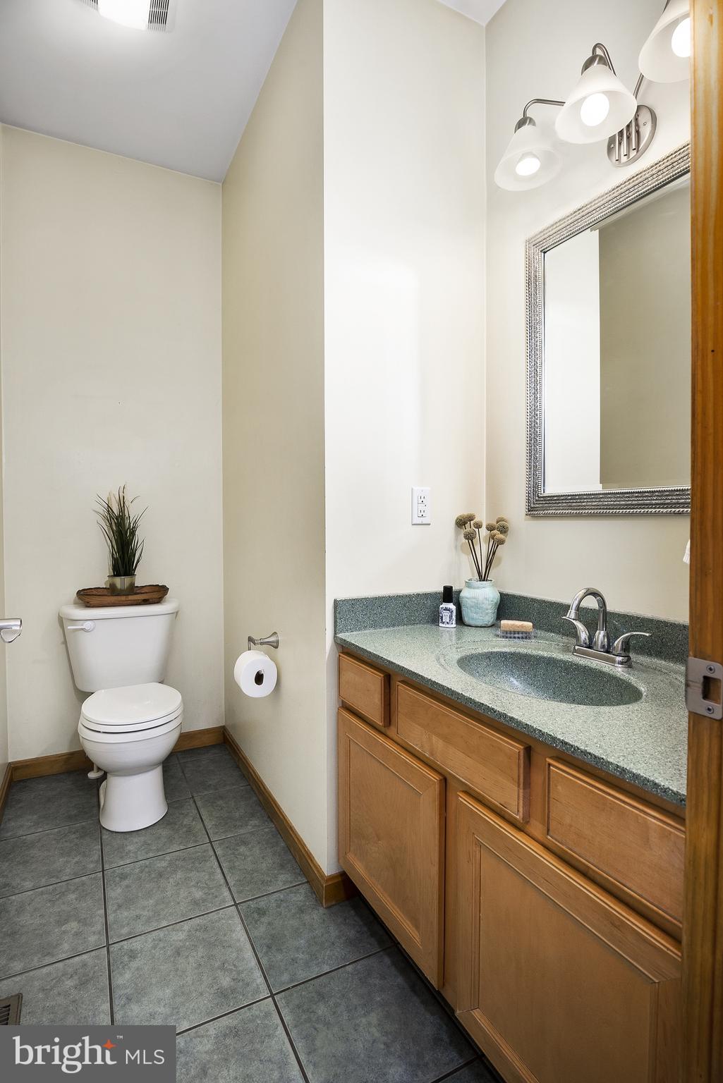 128 Carter Road Elkton, MD 21921 - Photo 25 of 73 Half bathroom near garage entrance.