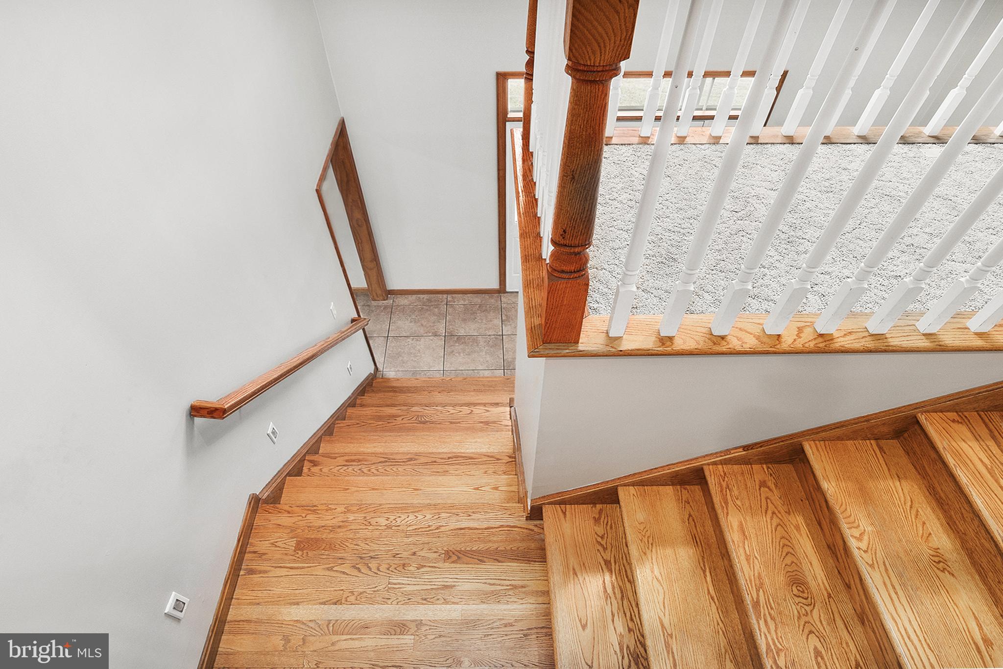 128 Carter Road Elkton, MD 21921 - Photo 27 of 73 Hardwood flooring on open stairway