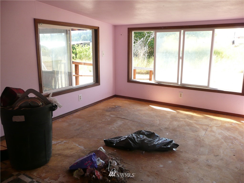 167 Yenter Road Republic, WA 99166 - Photo 3 of 11 a room with a window and a bicycle