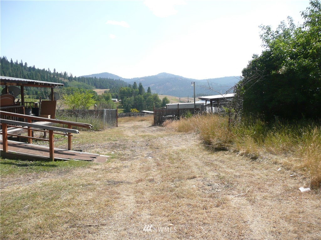 167 Yenter Road Republic, WA 99166 - Photo 7 of 11 a view of a lake with houses in the back