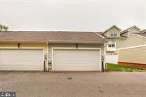 a front view of a house with a garage