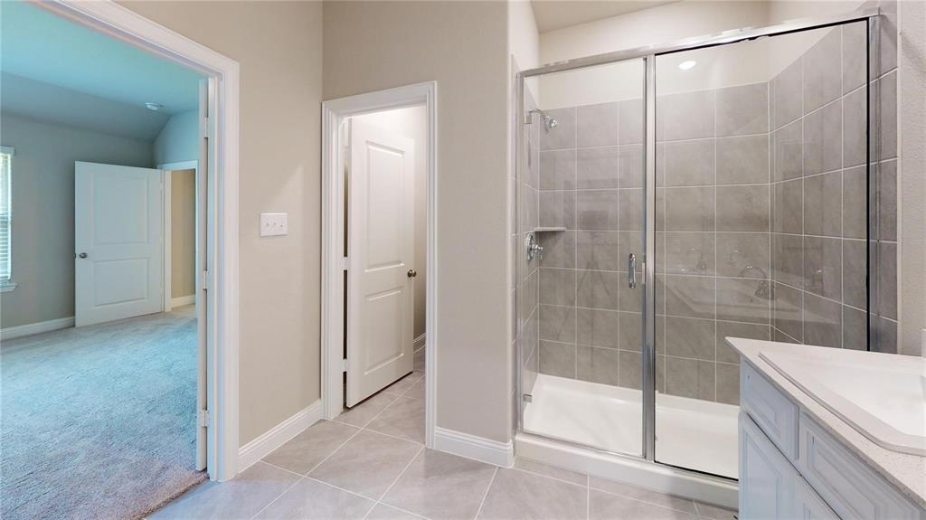 1420 Elizabeth Street Anna, TX 75409 - Photo 8 of 18 a bathroom with a shower and a sink