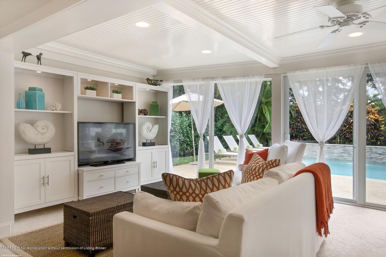 11 Ridge Boulevard Ocean Ridge, FL 33435 - Photo 11 of 26 a living room with furniture and a flat screen tv