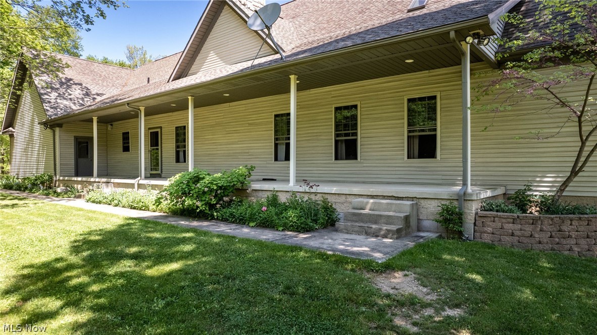 8403 Rochester Road East Rochester, OH 44625 - Photo 40 of 46 Rear view of property with a lawn and a porch