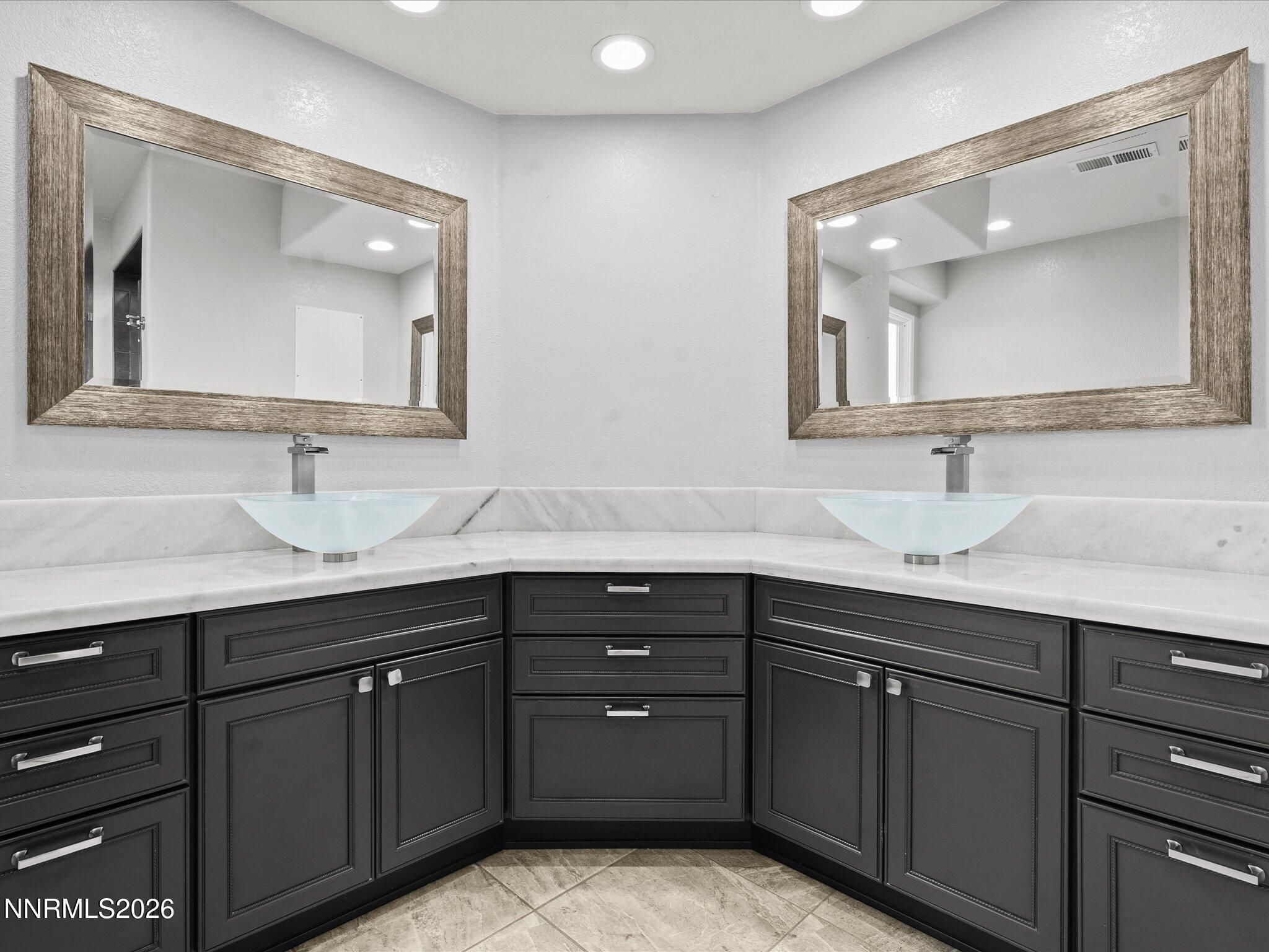 4943 Foxcreek Trail Reno, NV 89519 - Photo 13 of 26 a bathroom with a double vanity sink and mirror