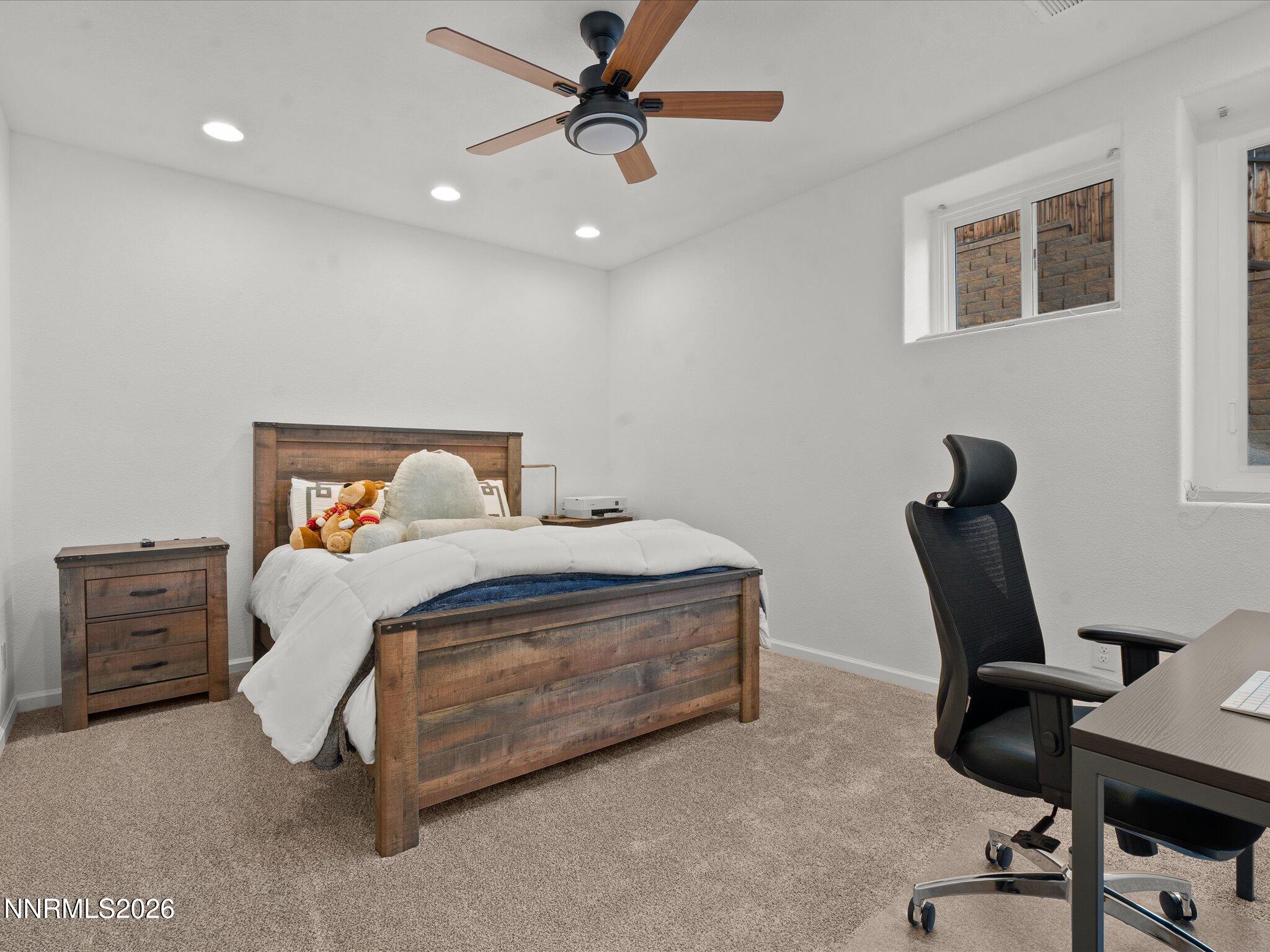 4943 Foxcreek Trail Reno, NV 89519 - Photo 14 of 26 a bedroom with a bed and a chair