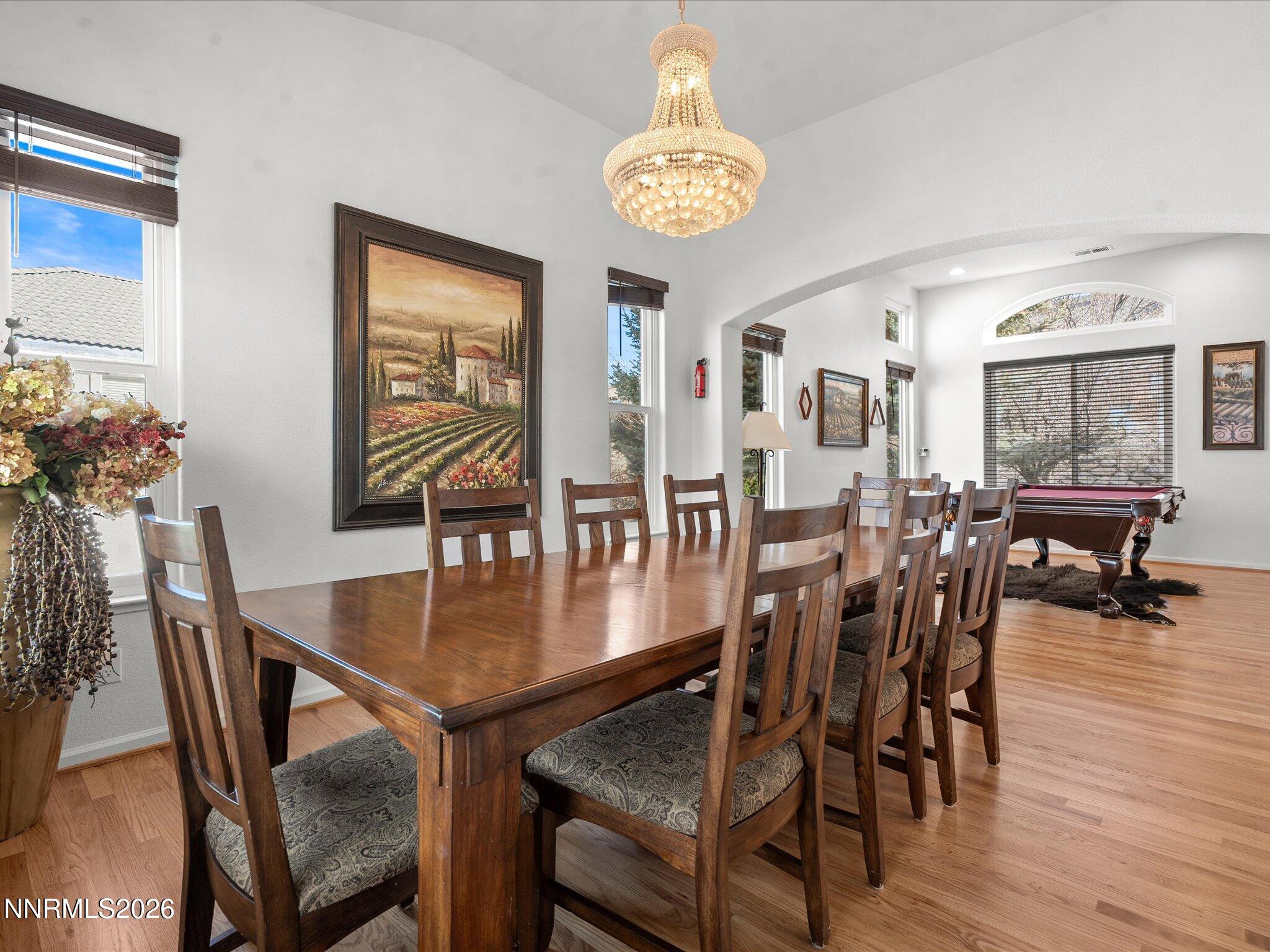 4943 Foxcreek Trail Reno, NV 89519 - Photo 2 of 26 a view of a dining room with furniture window and wooden floor