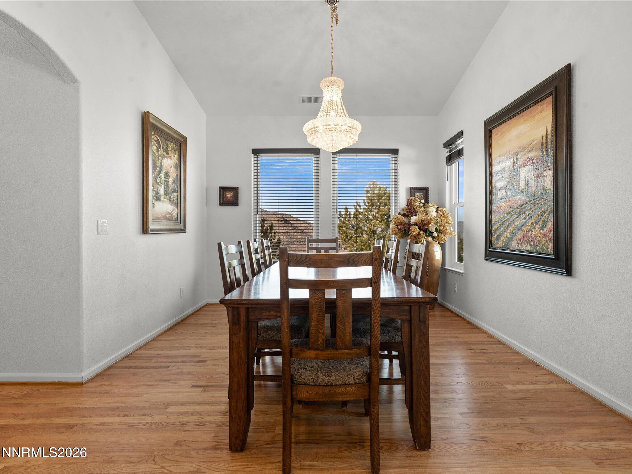 4943 Foxcreek Trail Reno, NV 89519 - Photo 3 of 26 a view of a dining room with furniture window and wooden floor
