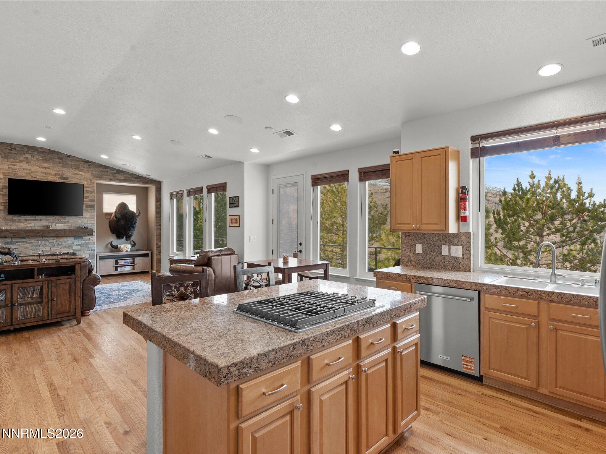 4943 Foxcreek Trail Reno, NV 89519 - Photo 4 of 26 a kitchen with a stove sink and microwave