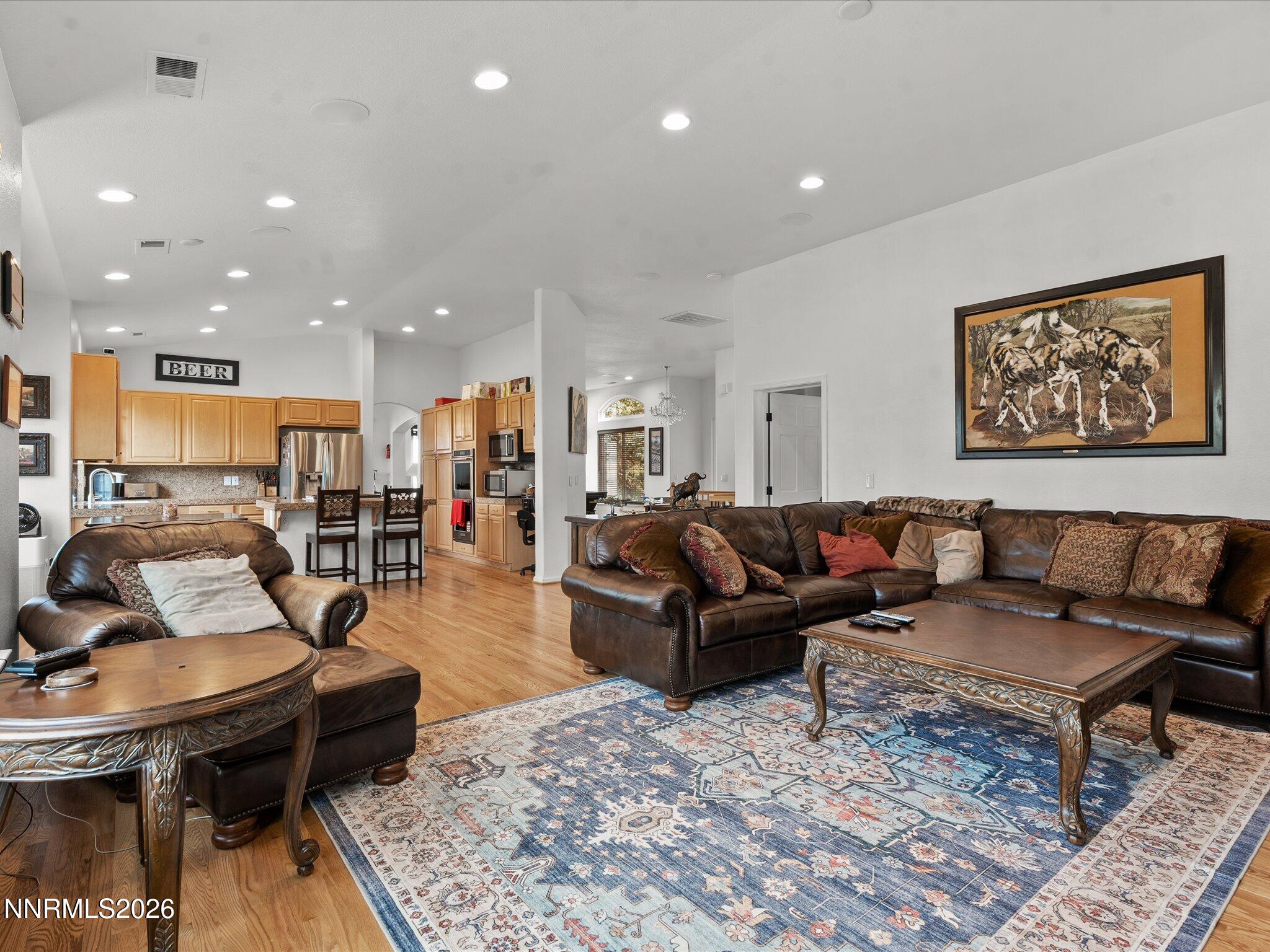 4943 Foxcreek Trail Reno, NV 89519 - Photo 6 of 26 a living room with furniture kitchen view and a table