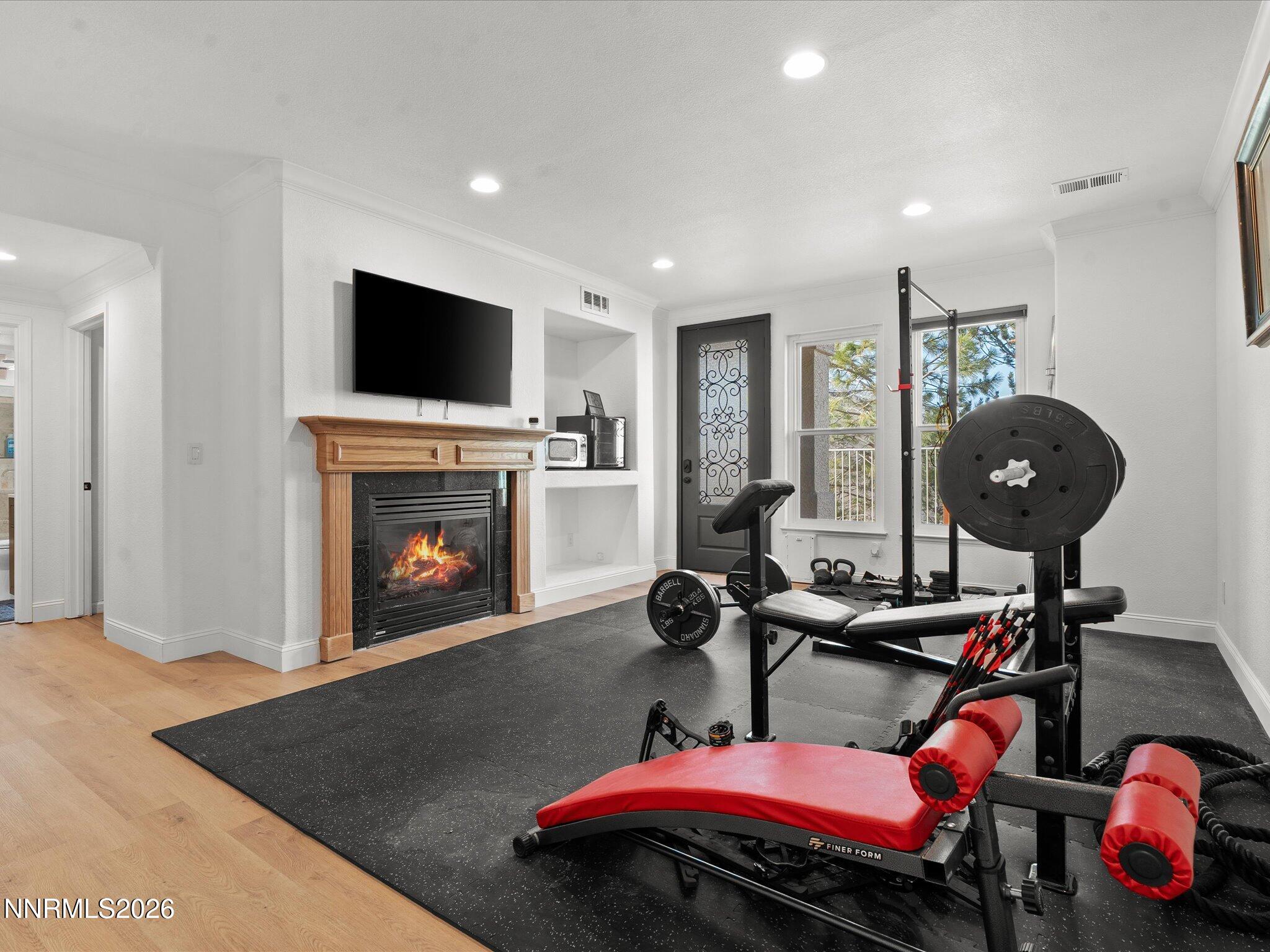 4943 Foxcreek Trail Reno, NV 89519 - Photo 10 of 26 a living room with furniture a flat screen tv and a fireplace