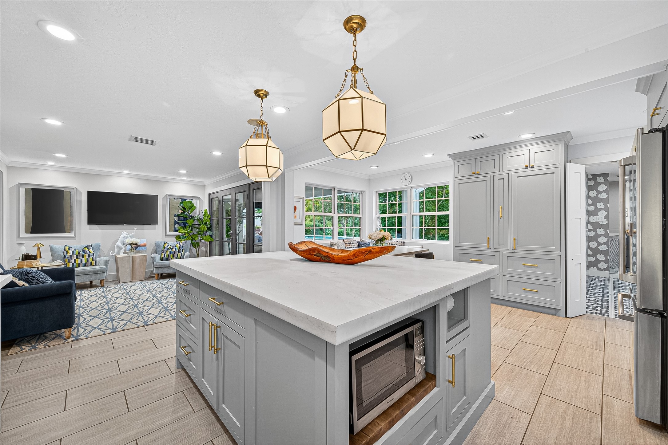 415 Ramblewood Road Houston, TX 77079 - Photo 10 of 49 Kitchen has a huge island and there is a sitting area in the background. It's really a welcoming space!