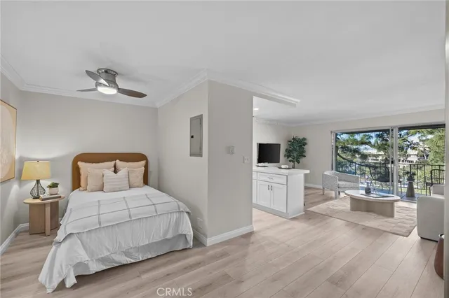 a bedroom with a large bed and a large window