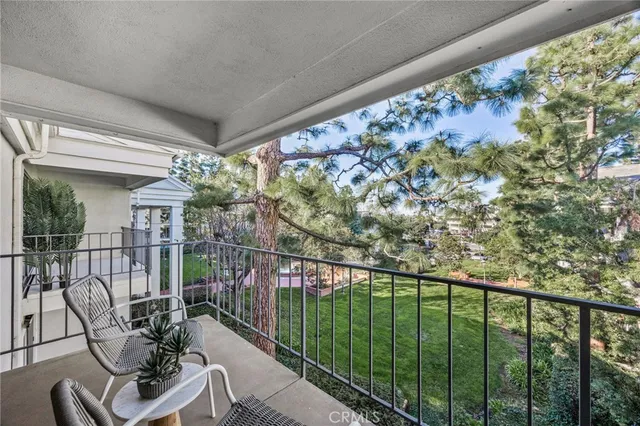 a view of a balcony with furniture