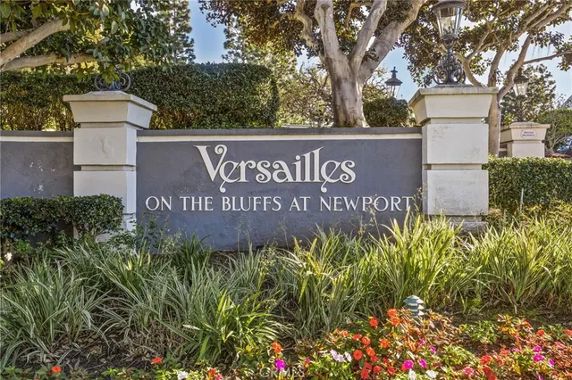 a front view of a house with a yard fountain