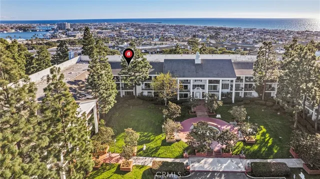 an aerial view of a house with a ocean view