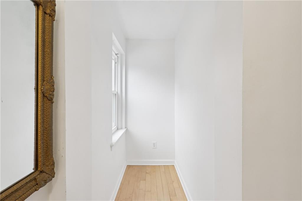 600 South Negley Avenue, Unit 16 Pittsburgh, PA 15232 - Photo 13 of 22 a view of a hallway with wooden floor