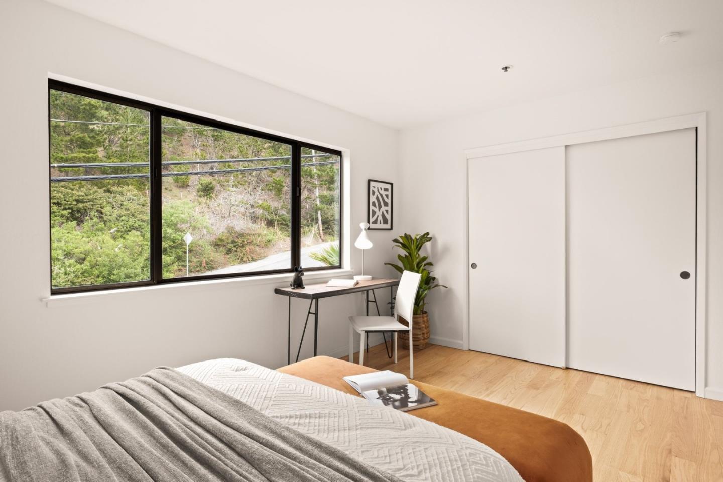 504 Monterey Road, Unit 14L Pacifica, CA 94044 - Photo 27 of 39 a bedroom with a bed and a window