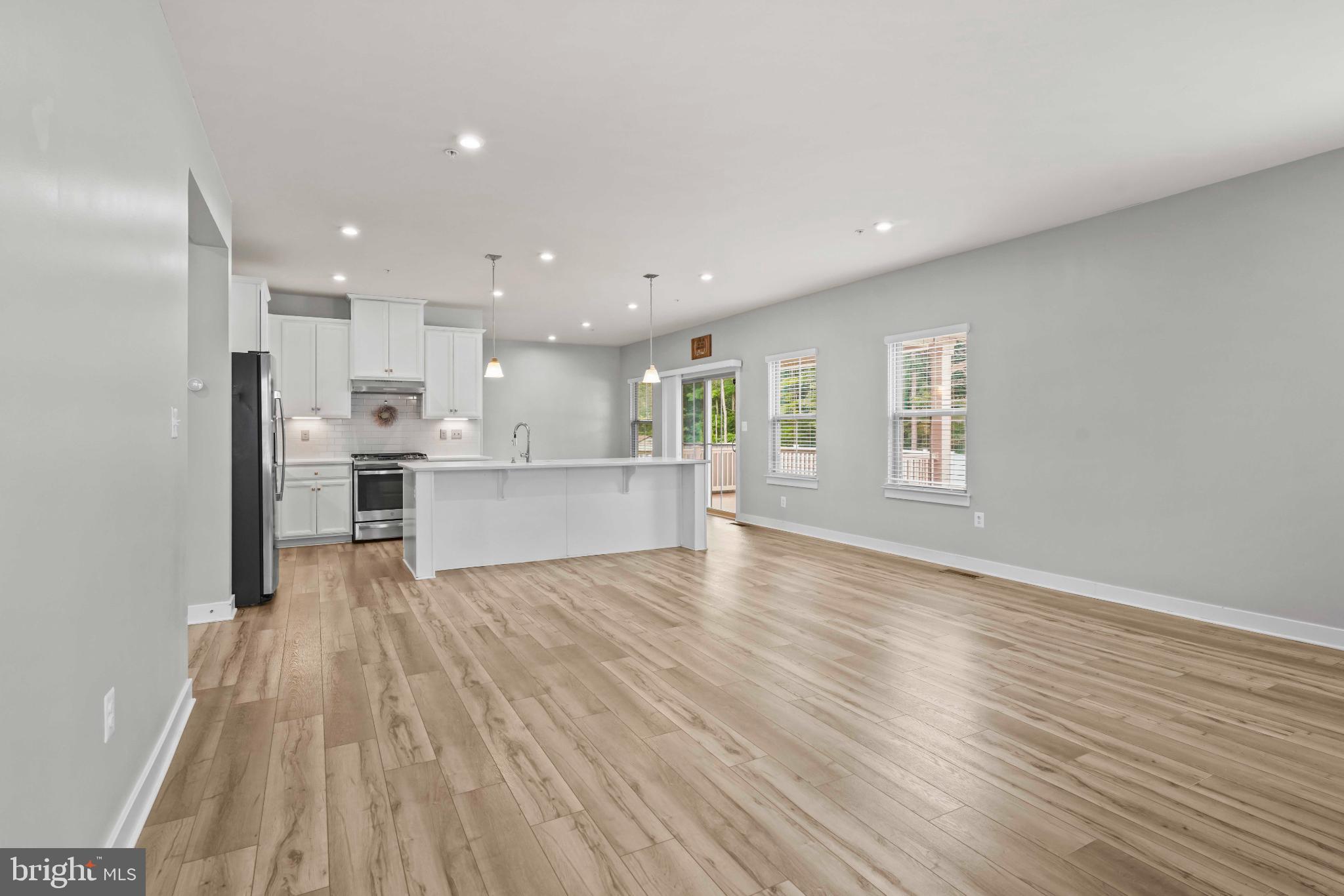 3903 Emory Ridge Road Brandywine, MD 20613 - Photo 43 of 43 a view of kitchen with wooden floor and windows