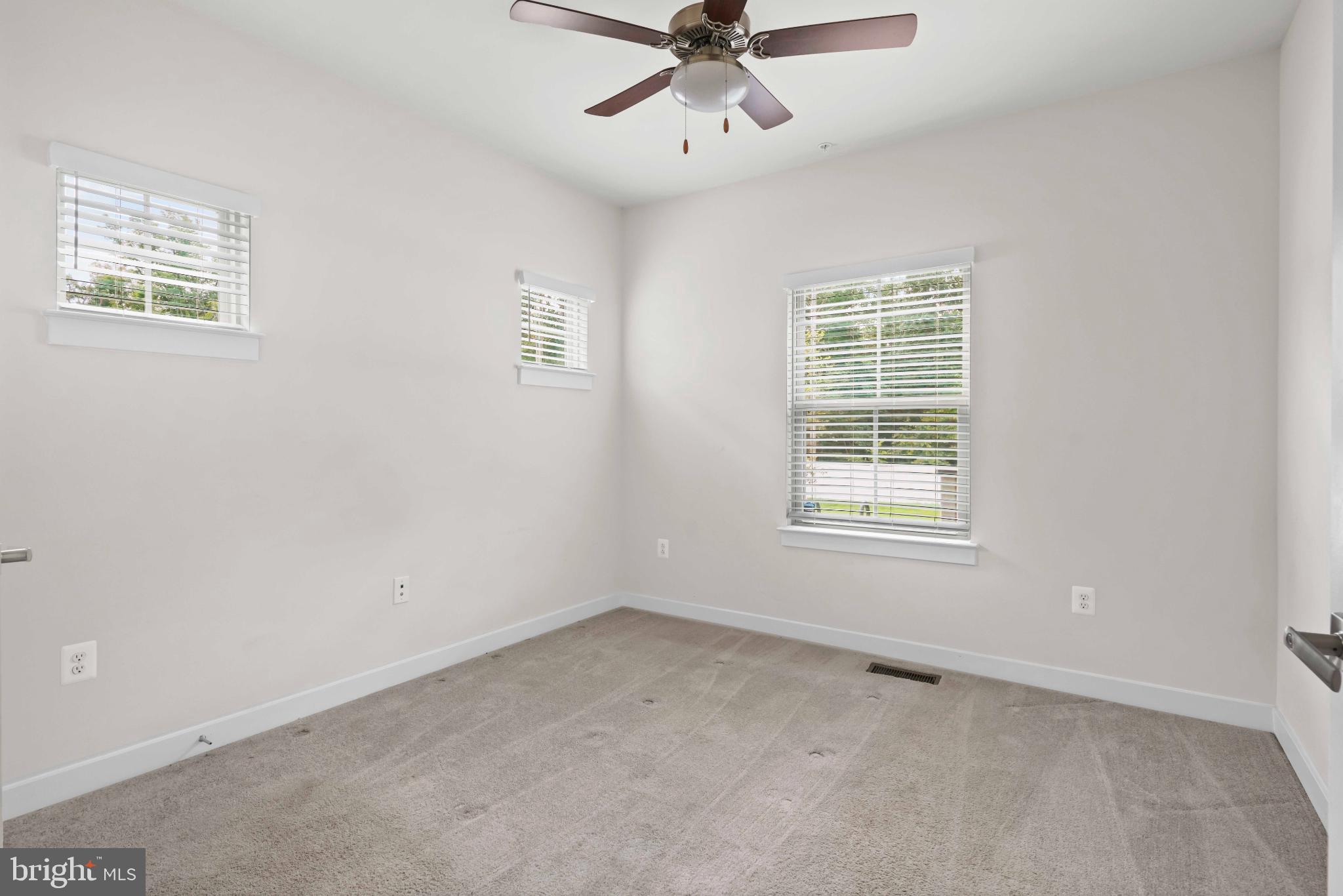 3903 Emory Ridge Road Brandywine, MD 20613 - Photo 13 of 43 an empty room with a window and a ceiling fan