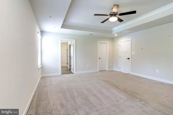 a view of a livingroom with a ceiling fan