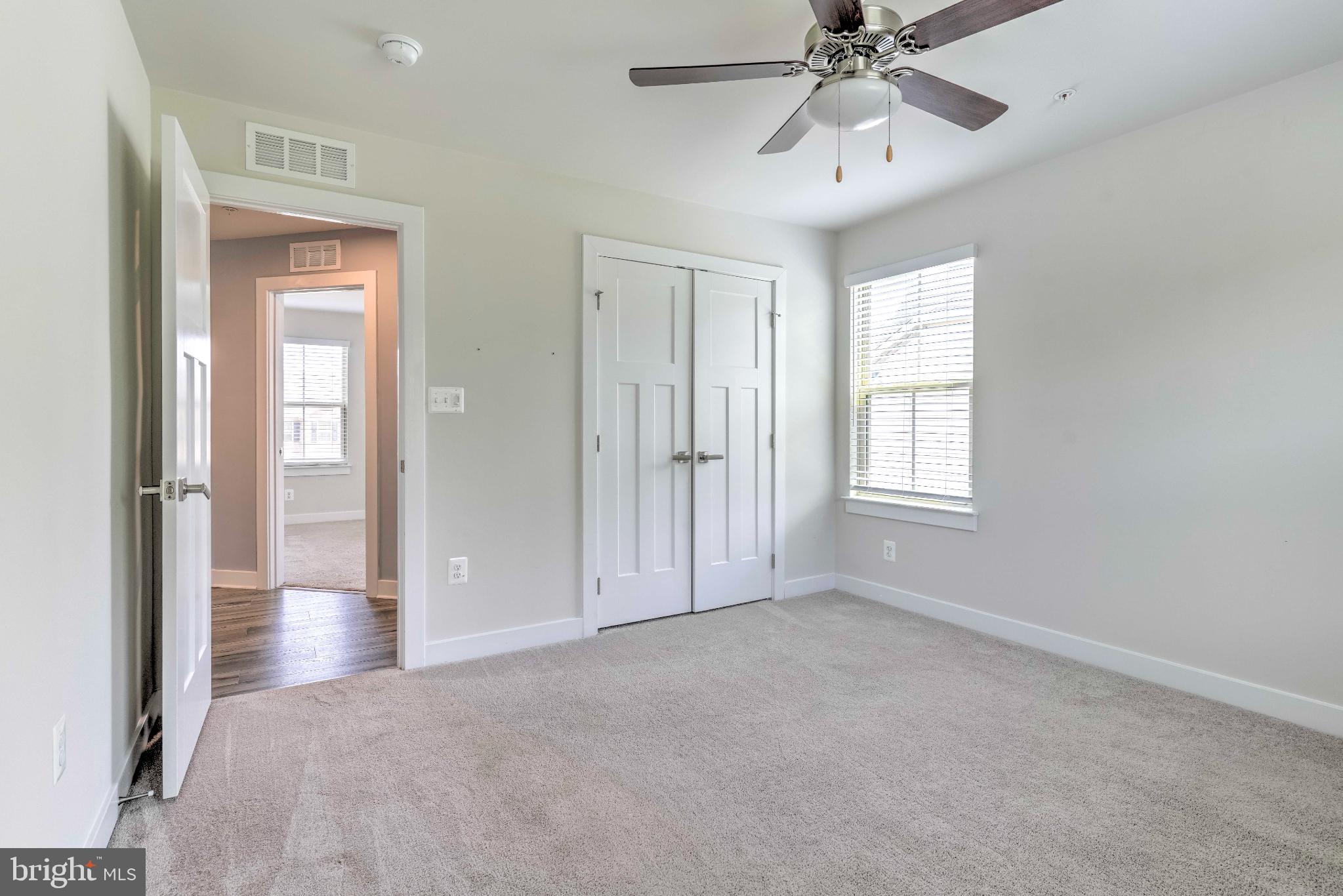 3903 Emory Ridge Road Brandywine, MD 20613 - Photo 24 of 43 a view of an empty room with chandelier fan and fire place