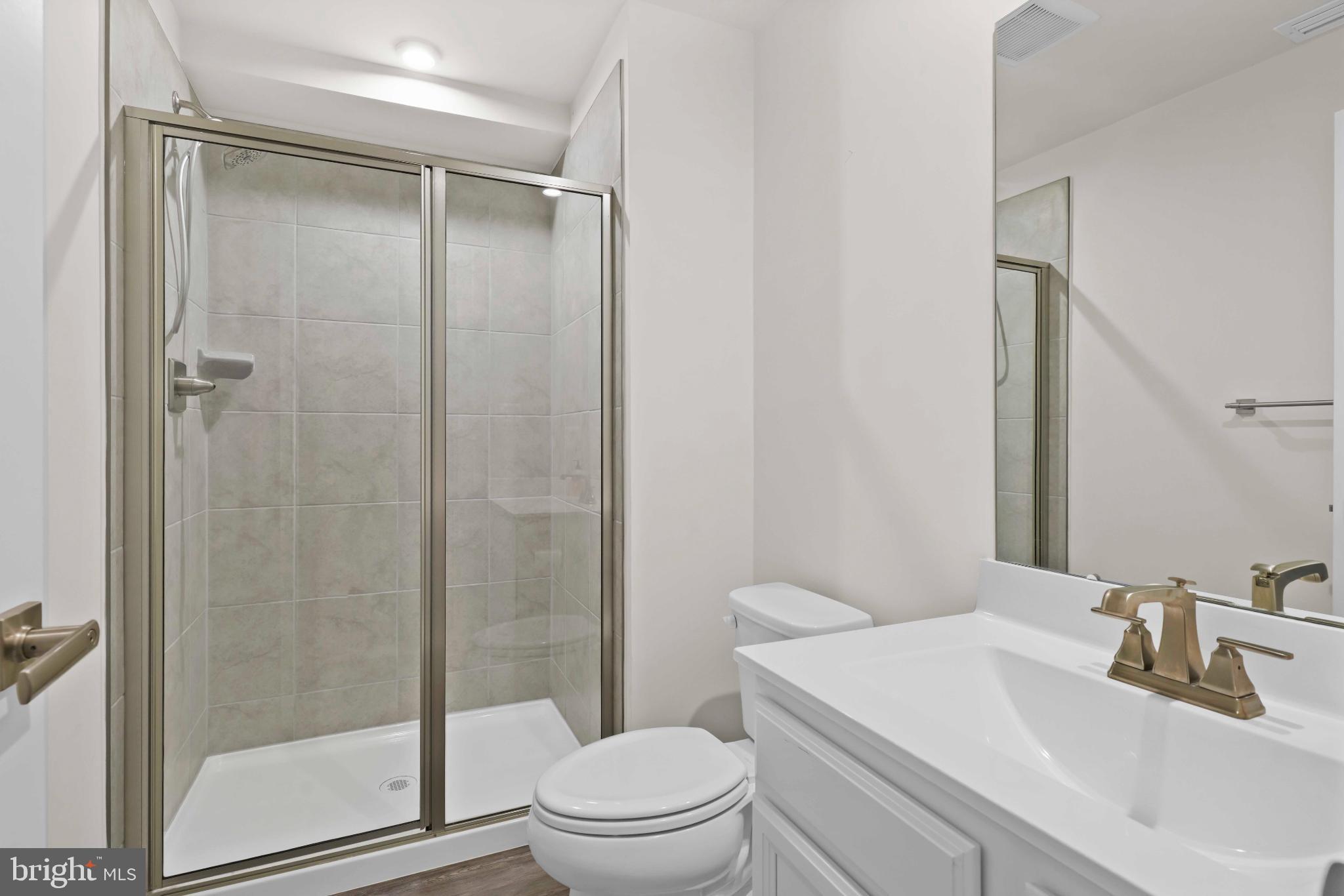 3903 Emory Ridge Road Brandywine, MD 20613 - Photo 26 of 43 a bathroom with a sink toilet and shower