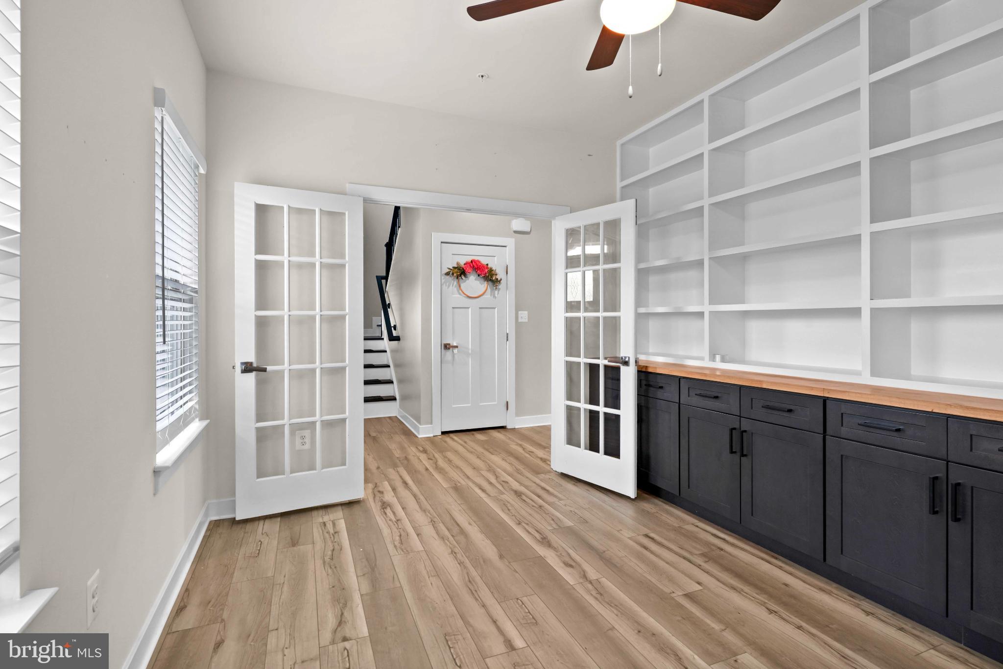 3903 Emory Ridge Road Brandywine, MD 20613 - Photo 3 of 43 a hallway with cabinets and wooden floor