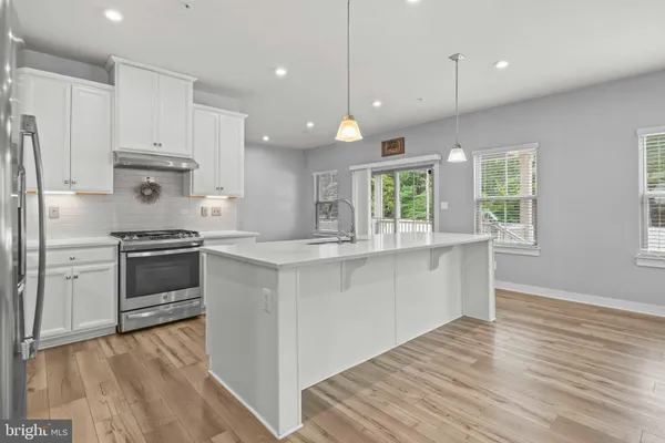 a kitchen with cabinets and appliances