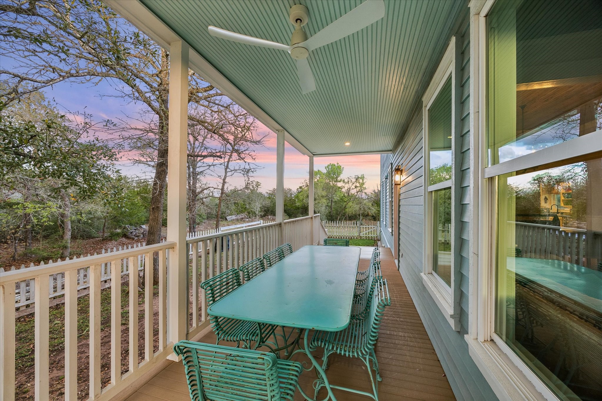 895 South Weyand Road Round Top, TX 78954 - Photo 12 of 37 a balcony with wooden floor and outdoor seating