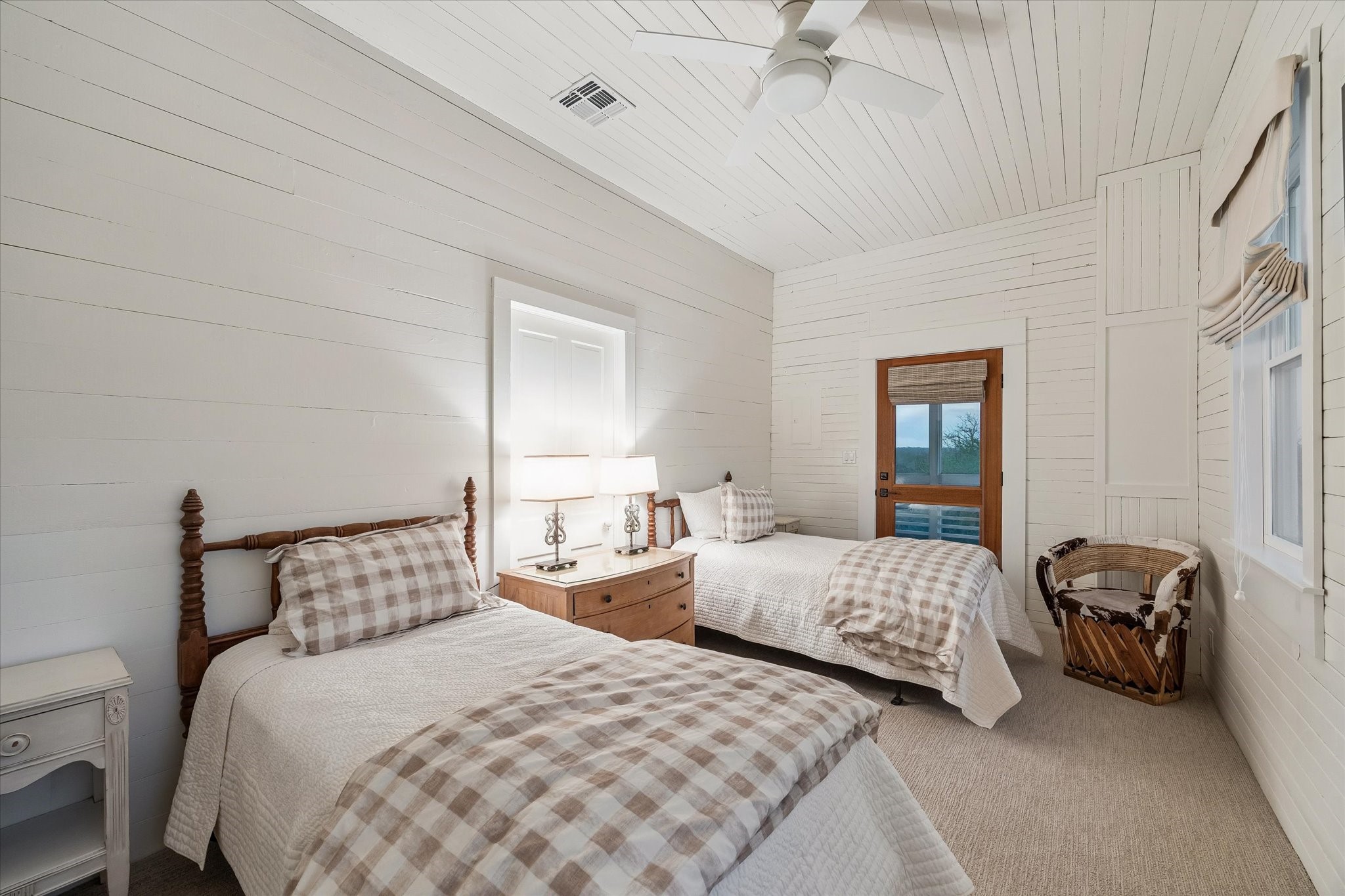 895 South Weyand Road Round Top, TX 78954 - Photo 19 of 37 a bedroom with two bed and a window
