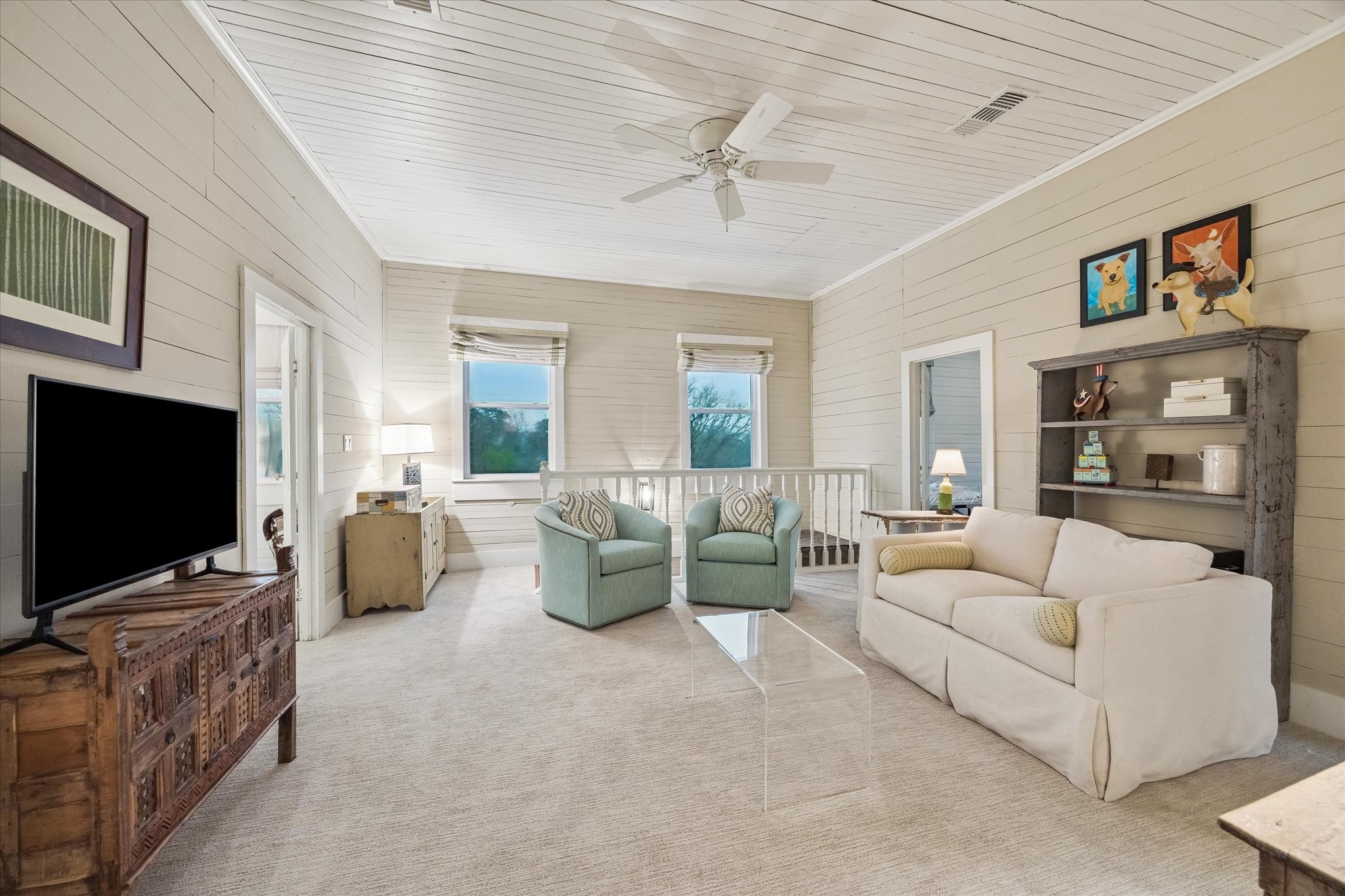 895 South Weyand Road Round Top, TX 78954 - Photo 27 of 37 a living room with furniture and a flat screen tv