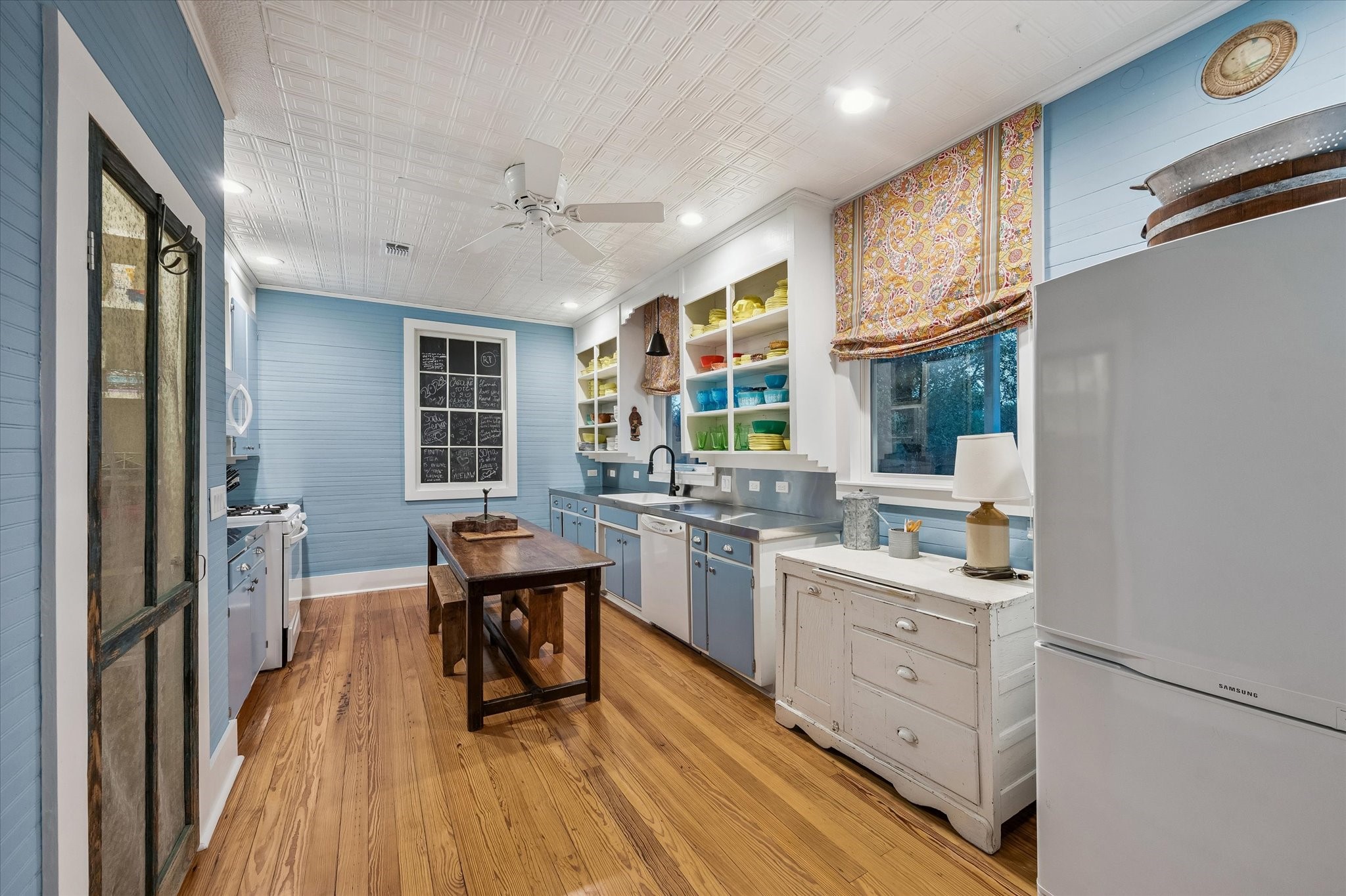 895 South Weyand Road Round Top, TX 78954 - Photo 29 of 37 a kitchen with a sink stove and cabinets