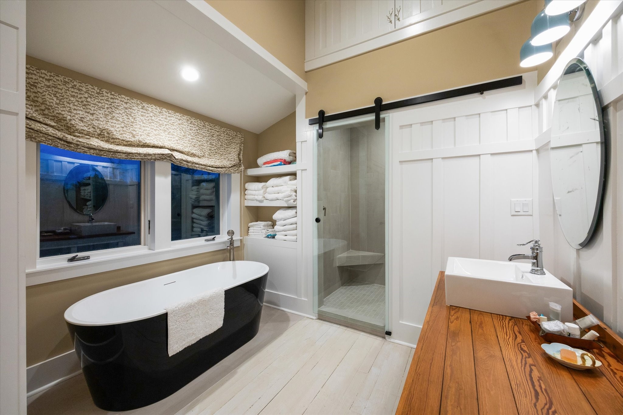 895 South Weyand Road Round Top, TX 78954 - Photo 7 of 37 1st floor Primary Bathroom (17x9) with soaking tub and walk-in shower. Separate vanities and walk-in closet.