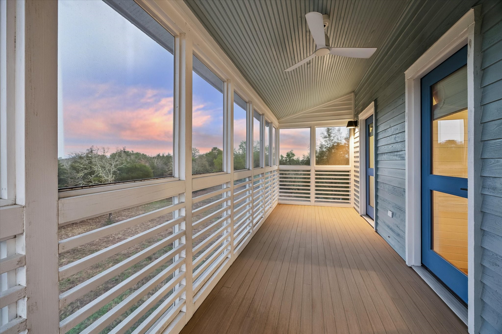 895 South Weyand Road Round Top, TX 78954 - Photo 9 of 37 a view of a balcony with wooden floor